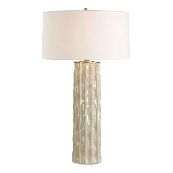 The Parilli Table Lamp Showcases An Organic Shaped Ceramic Base With Deep Vertical Channels And Wavy Ridges, Finished In A Taupe Gray Glaze And Paired With Brushed Nickel Details. The Round Hardback Drum Shade Is Covered In A Casual Off-white Linen Fabric With Natural Slubbing. Due To The Nature Of Fired Glazes On Ceramic Lamps, Finishes Will Vary Slightly. Collection: Parilli Finish: Brushed Nickel Glass: Round Hardback Rolled Edge Width: 20.00" Height: 35.00" Length: 20.00" Weight: 11.50 lb Number of Bulbs: 1 Maximum Wattage: 150.00 W Bulb Type: A Voltage: 110.00 V Material: Ceramic Country of Origin: Cambodia Safety Rating: Indoor Only