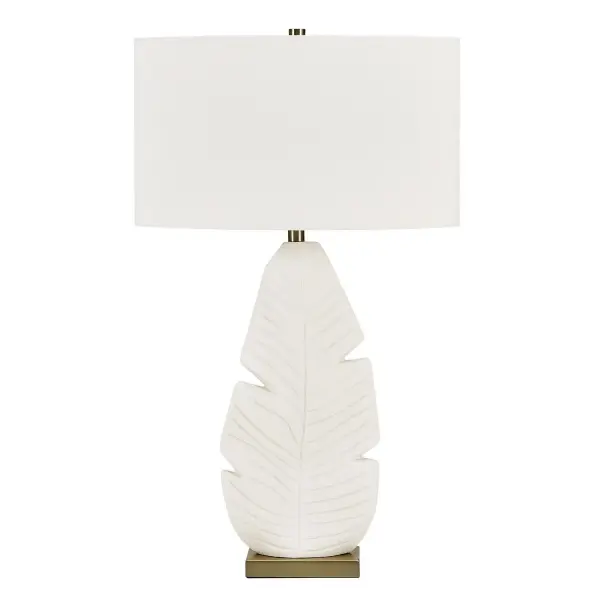 The Palm Leaf Table Lamp Features An Intricately Textured Ceramic Leaf Motif Finished In A Warm Matte White Glaze, Accented With Brass Plated Details. The Oval Hardback Shade Is Covered In A Crisp White Linen Fabric. Collection: Palm Leaf Designer: Grace Feyock Finish: Brass Width: 19.00" Height: 31.25" Length: 19.00" Weight: 9.00 lb Number of Bulbs: 1 Maximum Wattage: 150.00 W Bulb Type: A Voltage: 110.00 V Material: CERAMIC,FABRIC, GALVANIZED STEEL Country of Origin: Vietnam Safety Rating: Indoor Only