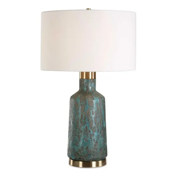 The Dauphine Table Lamp Features A Glass Base With A Dark, Crackle Textured Coating, Covered In A Volcanic-inspired Deep Teal Glaze, Paired With Antique Brass Plated Details. The Round Hardback Drum Shade Is Covered In A Crisp White Linen Fabric. Collection: Dauphine Designer: Renee Wightman Finish: Antique Brass Plated Glass: Drum Hardback Rolled Edge Width: 17.00" Height: 27.25" Length: 17.00" Weight: 12.10 lb Number of Bulbs: 1 Maximum Wattage: 150.00 W Bulb Type: A Voltage: 110.00 V Material: Steel, Glass, Fabric Country of Origin: China Safety Rating: Indoor Only