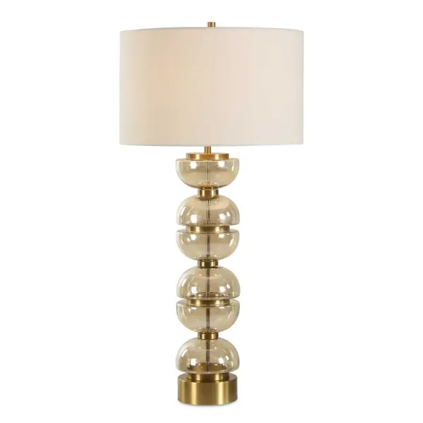 A Modern Statement Piece Featuring Stacked, Light Amber Glass Half-spheres And Luxurious Brass Plated Iron Accents. The Round Hardback Drum Shade Is Covered In A Casual White Linen Fabric. Collection: Assemble Designer: Renee Wightman Finish: Brass Plated Iron Glass: Round Drum Hardback Width: 17.00" Height: 35.00" Length: 17.00" Weight: 9.26 lb Number of Bulbs: 1 Maximum Wattage: 150.00 W Bulb Type: A Voltage: 110.00 V Material: Glass, Iron, Fabric Country of Origin: China Safety Rating: Indoor Only