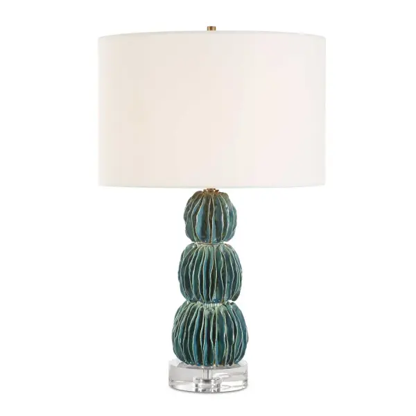 The Bonaire Lamp Showcases A Captivating Ceramic Base Of Stacked Spheres, Each Adorned With Carefully Folded And Layered Ceramic Disks. Each Piece Is A Unique Handcrafted Marvel, Finished In A Distressed Mottled Teal Blue Glaze. The Textural Interplay Is Further Enhanced By A Thick Crystal Foot And Brass Plated Details. The Round Hardback Shade Is Covered In A Crisp White Linen. Due To The Nature Of Fired Glazes On Ceramic Lamps, Finishes Will Vary Slightly. Collection: Bonaire Designer: Renee Wightman Finish: Brass Plated Glass: Round Drum Hardback Width: 13.00" Height: 25.25" Length: 13.00" Weight: 10.47 lb Number of Bulbs: 1 Maximum Wattage: 150.00 W Bulb Type: A Voltage: 110.00 V Material: Ceramic, Crystal, Iron, Fabric Country of Origin: China Safety Rating: Indoor Only
