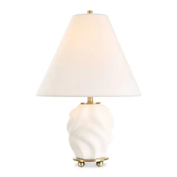 The Bora Accent Lamp Features A 3-dimensional Swirled Ceramic Base Finished In A Matte White Glaze, Accented With Brass Plated Details. The Coolie Style Shade Is Covered In A Crisp White Linen. Collection: Bora Designer: Renee Wightman Finish: Brass Plated Glass: Taper Hardback Shade Width: 12.00" Height: 17.50" Length: 12.00" Weight: 3.30 lb Number of Bulbs: 1 Maximum Wattage: 60.00 W Bulb Type: A Voltage: 110.00 V Material: Metal, Ceramic, Fabric Country of Origin: China Safety Rating: Indoor Only