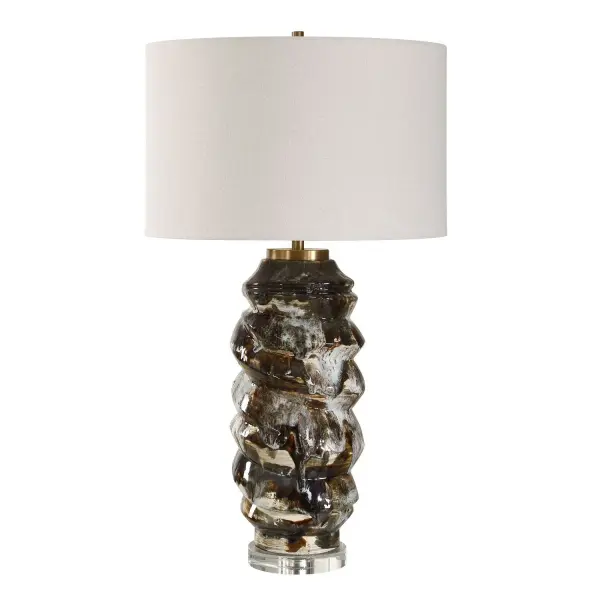 This Artistic Table Lamp Boasts A Unique Ceramic Base With A Textured Drip Glaze In Various Shades Of Chocolates Browns And Off Whites, Creating An Organic, Molten Effect. It Rests Elegantly On A Clear Crystal Foot, Accented With Antique Brass Plated Details. The Round Hardback Drum Shade Is Covered In A Warm White Linen Fabric. Due To The Nature Of Fired Glazes On Ceramic Lamps, Finishes Will Vary Slightly. Collection: Cuoco Designer: David Frisch Finish: Antique Brass Width: 18.00" Height: 31.75" Length: 18.00" Weight: 12.00 lb Number of Bulbs: 1 Maximum Wattage: 150.00 W Bulb Type: A Voltage: 110.00 V Material: Ceramics ,Crystal, Iron, Fabric Country of Origin: China Safety Rating: Indoor Only