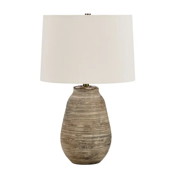 The Tonachio Table Lamp Features A Timeless Urn Ceramic Base With A Unique Scalloped Top Edge And Horizontal Etching, Finished In A Distressed Light Gray Wash With A Rustic Dark Brown Undertone, Accented With Brass Plated Details. The Slightly Tapered Round Shade Is Covered In A Warm White Linen Fabric. Collection: Tonachio Designer: Osvaldo Mendoza Finish: Brass Width: 16.00" Height: 25.25" Length: 16.00" Weight: 8.00 lb Number of Bulbs: 1 Maximum Wattage: 150.00 W Bulb Type: A Voltage: 110.00 V Material: CERAMIC,FABRIC, GALVANIZED STEEL Country of Origin: Vietnam Safety Rating: Indoor Only