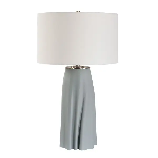 The Cover Up Table Lamp Features A Gracefully Sculpted Ceramic Base, Reminiscent Of Softly Draped Fabric, In Muted Light Blue And Accented With Antique Brass Plated Details. The Round Hardback Drum Shade Is Covered In A Crisp White Linen Fabric. Collection: Cover Up Finish: Antique Brass Width: 17.00" Height: 28.75" Length: 17.00" Weight: 8.80 lb Number of Bulbs: 1 Maximum Wattage: 150.00 W Bulb Type: A Voltage: 110.00 V Material: Iron,3D Ceramic,Fabric Country of Origin: China Safety Rating: Indoor Only