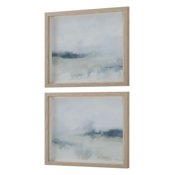 A pair of tranquil watercolor-style landscape prints in navy and sage, framed with white linen liners and natural wood frames for a relaxed coastal look.