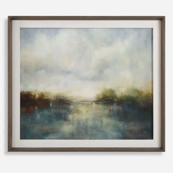 This large framed print pairs a moody blue landscape with an aged walnut frame and crisp white linen liner for an understated, tranquil accent.
