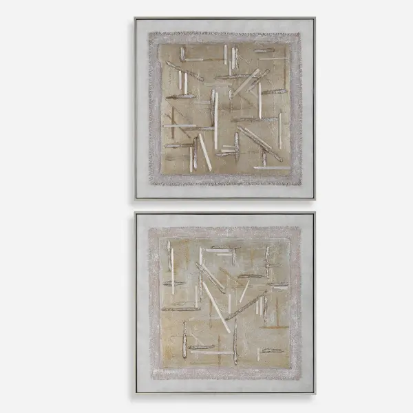 A set of two hand-painted canvases with layered linen and gypsum texture, framed in brushed champagne gold for a modern yet timeless accent.