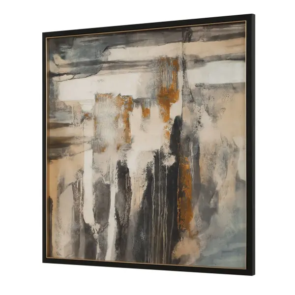 A striking abstract print in a black frame with gold liner, blending warm ochre with black, white, and gray for a sophisticated statement piece.
