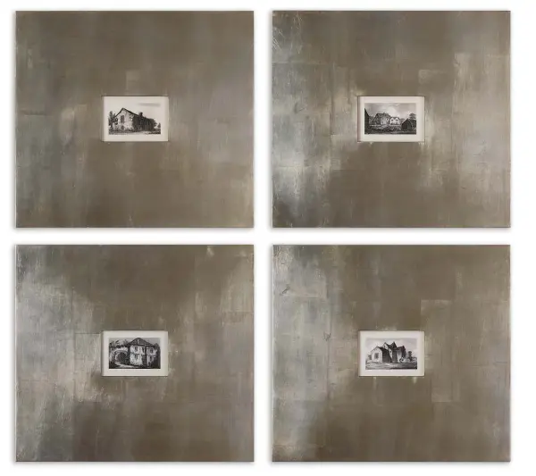 A pair of black-and-white historical building prints framed in an 8-inch wide champagne silver leaf frame with light brown glaze, protected under glass.