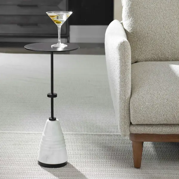 Combining A Black Metal Top With A Carved Marble Base, This Table Showcases Both Strength And An Artisanal Aesthetic, Embodying A Perfect Blend Of Durability And Elegance. Due To The Nature Of Natural Stone, Every Piece Will Vary Slightly Ensuring Yours Is Unique. Collection: Kincaid Designer: David Frisch Finish: Black Width: 11.00" Height: 24.00" Length: 11.00" Weight: 21.30 lb Material: Iron, Marble Country of Origin: China Safety Rating: Indoor Only