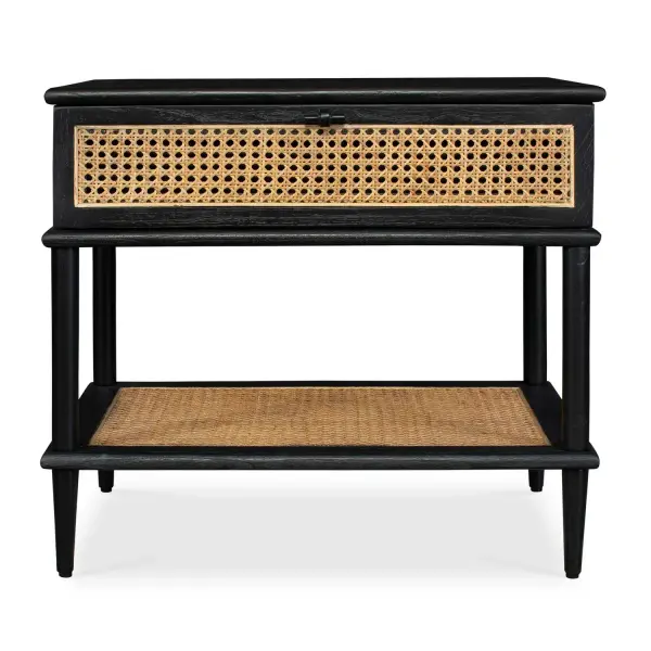 This Side Table, Crafted From Mindi Wood In A Sleek Black Finish, Showcases Natural Rattan Cane Webbing On The Drawer Front And Lower Shelf. It Is Beautifully Accented With Matte Black Hardware, Adding A Touch Of Contemporary Elegance To Its Design. Collection: Coast Finish: Black Width: 26.00" Height: 23.25" Length: 19.00" Weight: 29.76 lb Material: Mindi Wood And Mdf Mindi Veneer With Rattan Cane Country of Origin: Indonesia Safety Rating: Indoor Only