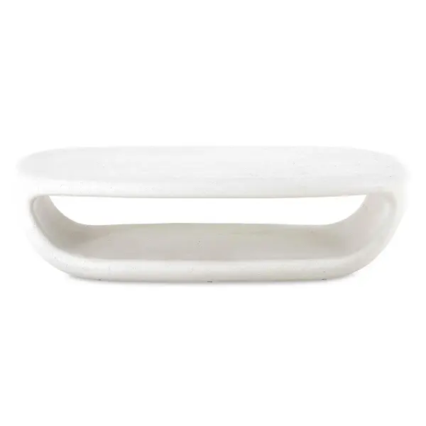 A statement-making GFRC concrete coffee table with a hollow center for storage, finished in smooth warm white and rated for indoor or outdoor use.