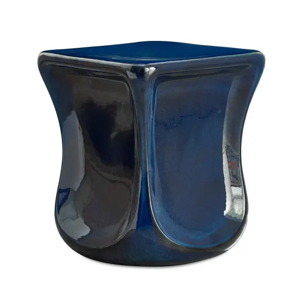 This Sculptural Stool Made Entirely Of Earthenware Clay Features Dramatic Scooped-in Sides Covered In A Deep, Lustrous Blue Glaze. Due To The Nature Of Fired Glazes On Pottery, Finishes Will Vary Slightly. May Be Used Outdoors, But Protection From Freezing Temperatures Is Recommended. Collection: Kaz Designer: Grace Feyock Finish: Blue Glaze Width: 15.00" Height: 18.25" Length: 15.00" Weight: 31.38 lb Material: Earthenware Country of Origin: Vietnam Safety Rating: Indoor/Outdoor