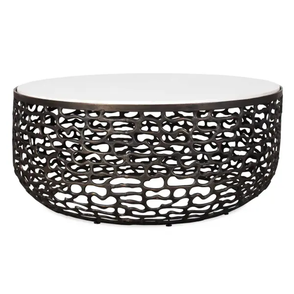 This Striking Coffee Table Boasts A White Marble Top With Subtle Gray Veining, Creating A Luxurious Contrast With The Golden Dark Bronze Finish Of Its Intricately Patterned Cast Aluminum Base. Due To The Nature Of Natural Stone, Every Piece Will Vary Slightly Ensuring Yours Is Unique. Suitable For Both Indoor And Outdoor Use. Collection: Sabena Designer: David Frisch Finish: Dark Bronze Width: 36.00" Height: 16.00" Length: 36.00" Weight: 86.20 lb Material: Metal, White Banswara Marble Country of Origin: India Safety Rating: Indoor/Outdoor