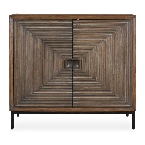 Crafted From Mindi Wood In A Warm Finish, The Bottom Line Two-Door Cabinet Features Carved Detailing That Accentuates The Natural Wood Grain And Design, Beautifully Contrasted By Sleek Bronze Metal Legs And Door Pulls. Collection: Bottom Line Designer: David Frisch Finish: Bronze Width: 36.00" Height: 33.00" Length: 14.00" Weight: 33.00 lb Material: MDF MINDI VENEER AND MINDI WOOD Country of Origin: Indonesia Safety Rating: Indoor Only