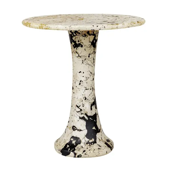 A distinctive pedestal side table pairing natural coral stone with black resin accents. Each piece varies slightly, and it's rated for indoor or outdoor use.