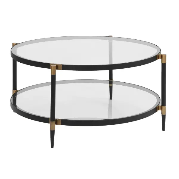 This Elegant Coffee Table Features A Sleek Black Iron Frame With Sophisticated Gold Accents. It Includes Two Tempered Glass Shelves For A Light And Airy Feel. Collection: Chadid Designer: Grace Feyock Finish: Black Iron Width: 39.00" Height: 18.25" Length: 39.00" Weight: 60.00 lb Material: IRON, TEMPERED GLASS Country of Origin: China Safety Rating: Indoor Only
