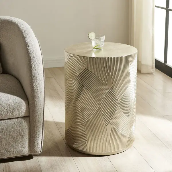 An Intertwining Texture And Soft Gold Leaf Finish Transform This Accent Table Into A Mesmerizing Sculptural Statement That Is Both Playful And Chic. Collection: Cassandra Designer: Renee Wightman Finish: Gold Leaf Width: 16.00" Height: 24.00" Length: 16.00" Weight: 41.25 lb Material: Resin With Silver Leaf,Plywood,Alder Solid Country of Origin: Vietnam Safety Rating: Indoor Only
