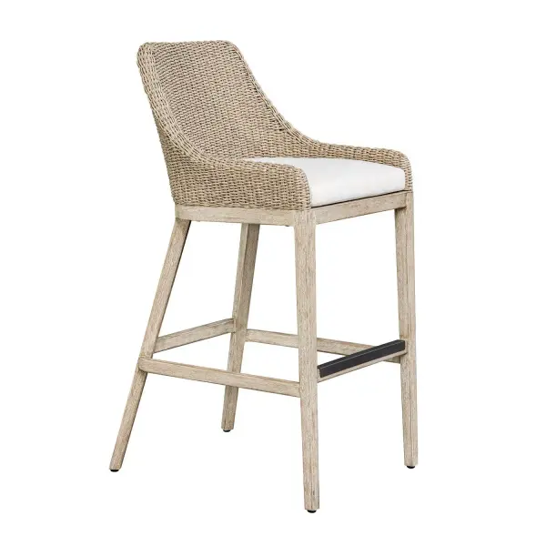 Enjoy Alfresco Dining In The Paloma Outdoor Bar Stool. It's Gently Sloped And Curved Back Gives Supportive Comfort, Wrapped In Twisted Oatmeal All-weather Wicker, Atop A Durable Mahogany Wood Frame Finished In Cerused Wheat, Ensuring Long-lasting Use. The Plush Cushion Is Upholstered In Oyster White Solution Dyed Acrylic Fabric That Is Constructed To Withstand The Moisture And Dirt That Comes With Outdoor Use. Collection: Paloma Finish: Mahogany Wood Width: 21.20" Height: 44.70" Length: 24.40" Weight: 21.30 lb Material: MAHOGANY WOOD AND ALUMINUM WITH WICKER AND FABRIC REGENCY CRESCENT CLOUD DANCER Country of Origin: Indonesia Safety Rating: Indoor/Outdoor