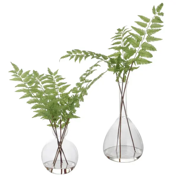 This tabletop fern arrangement in a glass vase with faux water brings natural, whimsical charm to shelves, consoles, and entryways with minimal upkeep.