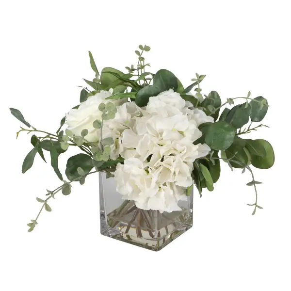 This faux cream hydrangea and rose arrangement in a glass vase brings an airy, garden-fresh look to any tabletop without the upkeep of real flowers.