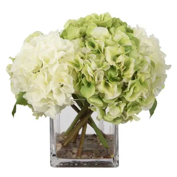 This white and limelight hydrangea arrangement in a square glass vase brings a soft, garden-fresh look to tabletops without any maintenance required.