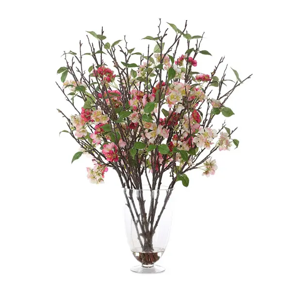 Petite cherry blossom florals in ivory and blush arranged in a glass pedestal vase with faux water for a lasting spring display.