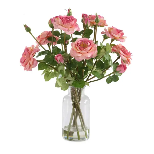This pink rose bouquet in a glass medicine jar brings soft, romantic color to any shelf or tabletop without the upkeep of fresh flowers.