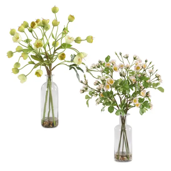 A charming set of two faux hellebore arrangements in glass medicine jars with natural rocks and faux water, offering an easy botanical accent for tabletops and shelves.