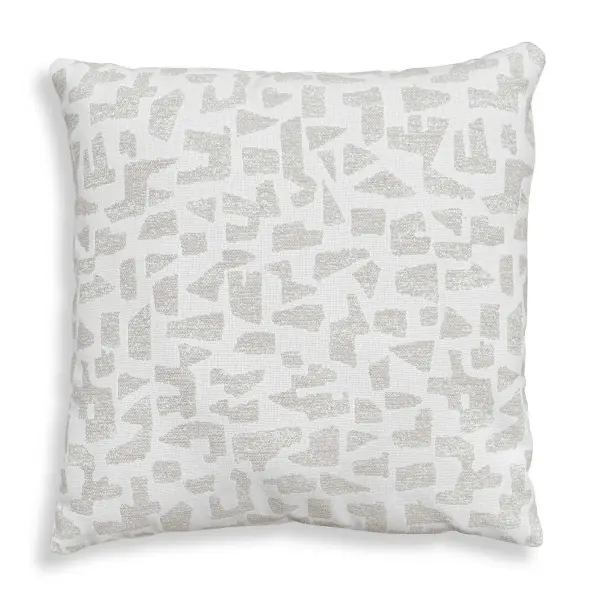 A cream woven Sunbrella acrylic pillow with a multi-tonal putty abstract pattern, filled with plush microdenier polyester. Durable enough for indoor/outdoor settings.