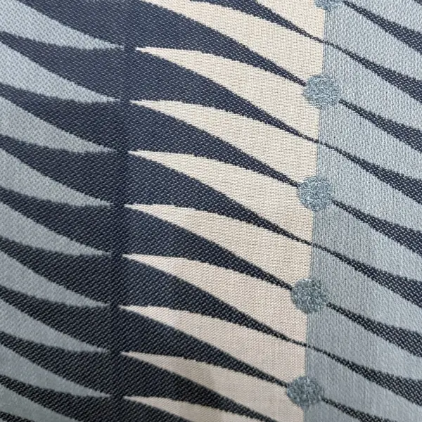 A 20-inch square outdoor accent pillow with wave-like bouclette texture in Sunbrella acrylic, designed in collaboration with Block Shop Textiles for durable outdoor styling.