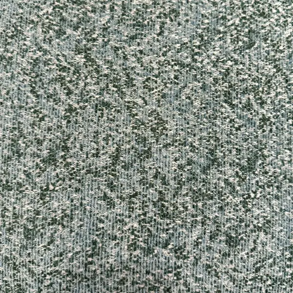 A woven chenille outdoor pillow in cream with juniper and sea salt tones, made from Sunbrella acrylic for durability against sun and moisture.