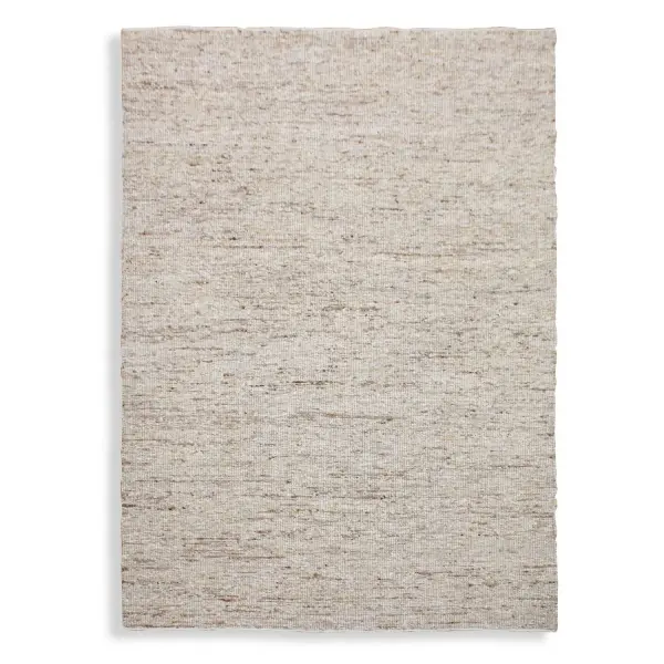 A hand-knotted wool and jute blend rug offering casual, upscale texture. Undyed natural tones suit organic and coastal interiors seeking warmth underfoot.