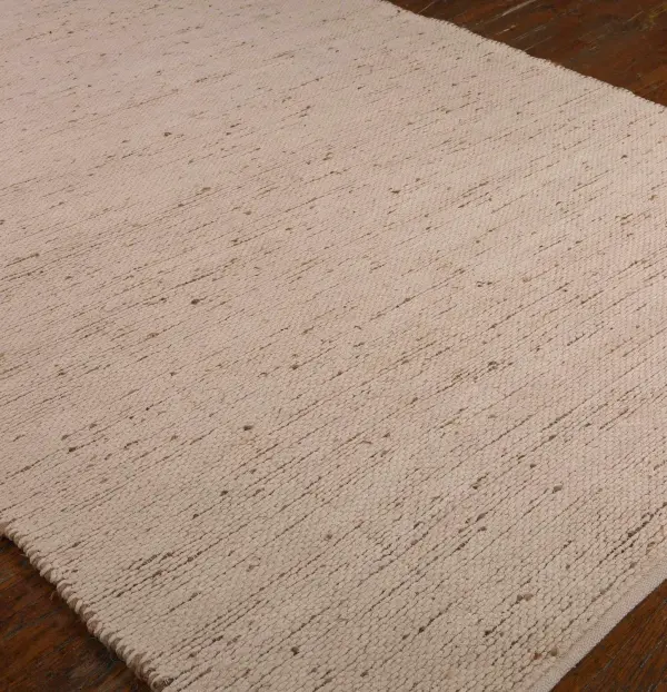 A hand-woven hemp and chenille rug with natural texture and reversible construction, best suited to low-traffic living spaces rather than high-traffic zones.