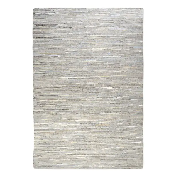 A large hand-woven hemp and recycled leather rug in soft neutral tones with subtle blue accents, ideal for anchoring spacious living or dining areas.