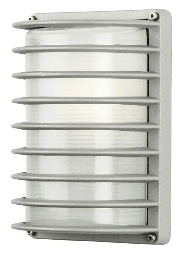 The Basis Rectangular Grid outdoor wall light combines clean geometric lines with functional outdoor lighting. Its compact 10-inch profile and grid design make it ideal for modern exteriors and entryways.