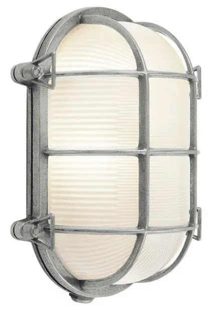 The Tortuga Ovale brings contemporary coastal style to outdoor spaces with its distinctive oval glass shade and compact 10.5-inch profile. Ideal for flanking doorways or illuminating patios and porches.