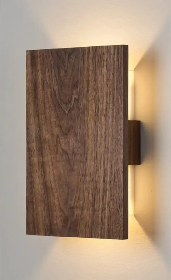 The Timber Bronze Wall Sconce brings organic warmth to any space with its natural walnut wood construction and bronze metal accents. Perfect for creating ambient lighting in rustic, farmhouse, or modern organic interiors.