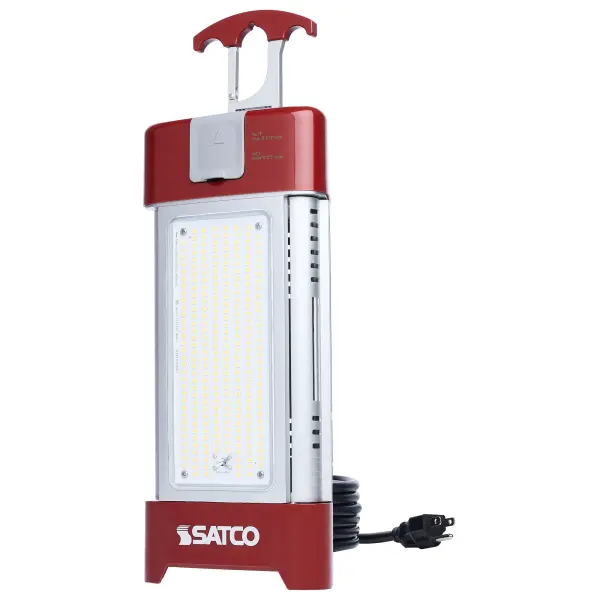 SATCO NUVO's Multi-Beam Temporary Work Light offers powerful, flexible illumination in a sleek new design. This 120V fixture features selectable wattages from 30W to 120W, producing up to 19,820 lumens at 5000K. Dual light panels expand from 10 to 360 degrees, with adjustable beam angles of 180, 280, or 360 degrees to direct light where needed. It includes a 10-foot power cord and integrated outlet for linking up to eight fixtures. A removable T-handle allows quick accessory changes, and a safety cable mounting kit is included for secure installation. The remote control offers on/off and dimming functionality. Built from durable plastic and aluminum with a clear polycarbonate lens and high-visibility gloss red finish, this fixture supports multiple setup configurations for maximum versatility.