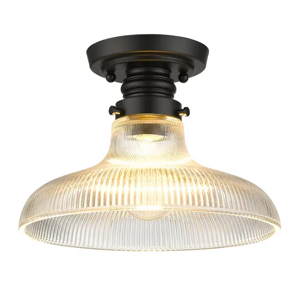 Bring industrial elegance into your home with the Wry Lighting Clary 1-light Flush Mount. Featuring a glass shade and a matte black frame, it creates a welcoming atmosphere. This glass shade, crafted from ribbed optic glass, creates a stunning prismatic effect as light beautifully refracts and bends, animating any space with its vintage-inspired charm. The matte black finish is both timeless and versatile, offering an understated elegance that complements various decor styles, from minimalist to bold contemporary. Ideal for low ceilings in hallways, closets, laundry areas, or bathrooms, it's also damp location rated for occasional moisture exposure, making it suitable for spaces like covered porches or laundry rooms. Overall dimensions: 9.88"W x 7"H x 9.88"D. Requires 1 E26 Medium base bulb (not included), with a maximum wattage of 100. The Clary flush mount is the perfect blend of form and function, making it an excellent choice for any modern home. Collection: Clary Finish: Matte Black Glass: Ribbed Optic Glass Width: 9.88" Height: 7.00" Length: 9.88" Weight: 3.08 lb Extension from Wall: 9.88" Canopy: 4.75"W x 4.75"H x 0.88"D Number of Bulbs: 1 Maximum Wattage: 100.00 W Bulb Type: A19 Bulb Base: E26 Light Source: Incandescent Dimmable Voltage: 120.00 V Country of Origin: China Safety Listing: ETL Manufacturer Warranty: 1 Year Limited