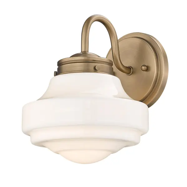 The Ingalls wall sconce combines classic tiered design with modern brass finish and vintage milk glass for a soft, glare-free glow. Damp-rated for versatile placement in bathrooms and hallways, it bridges traditional and contemporary styles.