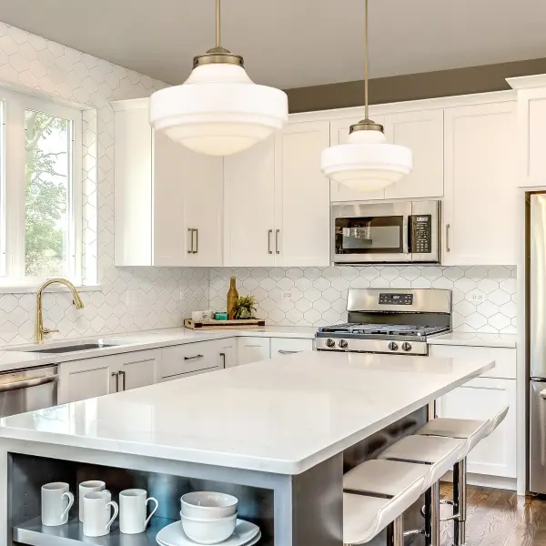 The Ingalls pendant combines vintage schoolhouse design with contemporary farmhouse style. Its 16-inch milk glass shade provides soft, glare-free illumination while the brushed brass finish adds warmth and sophistication. - alternate view