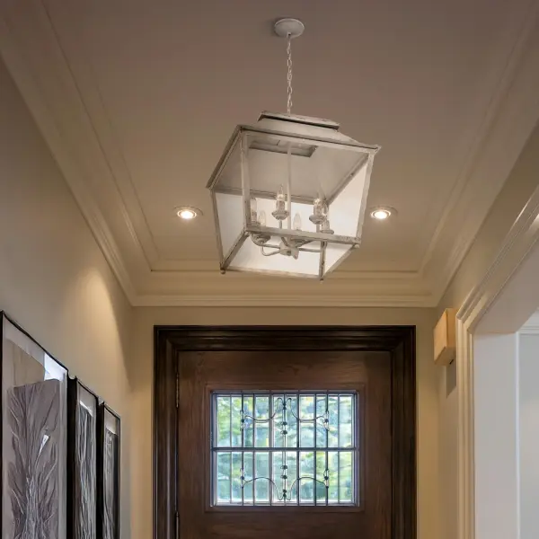 The Abingdon 6-light pendant combines European heirloom charm with farmhouse elegance. Its distressed Antique Ivory finish and clear glass shades create warm, inviting illumination perfect for dining rooms and entryways. - alternate view