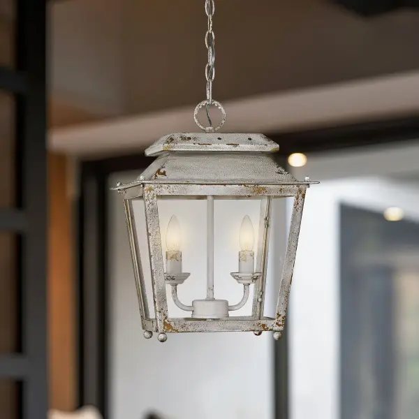 The Abingdon pendant brings artisan-crafted charm with its distressed antique ivory finish and clear glass shade. Perfect for adding vintage warmth to kitchens and dining spaces with adjustable height for various ceiling configurations. - alternate view