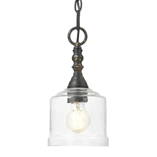 Bring rustic warmth into your home with the Golden Lighting Keating 1-light Pendant. Featuring a glass shade and an Antique Black Iron frame, it creates a compelling statement of style. This pendant features a Hammered Water Glass shade that provides a beautifully distorted and refractive light effect. The glass showcases a heavy, irregular texture that captures a dynamic glow, enhancing the pendant's rustic elegance. Perfect for kitchens, dining rooms, and entryways, this fixture is Dry Location Rated, making it suitable for indoor spaces. Installation is sloped ceiling compatible, with an adjustable height ranging from 15.25" to 88.75". It requires 1 E26 Medium base bulb (not included) with a maximum wattage of 100. Overall dimensions of 5.88"W x 11.75"H x 5.88"D ensure it adds a stylish touch without overwhelming the space. Embrace artisanal craftsmanship with this unique ceiling pendant that elevates your décor.