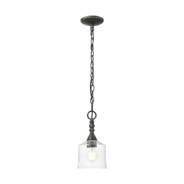 Bring rustic warmth into your home with the Golden Lighting Keating 1-light Pendant. Featuring a glass shade and an Antique Black Iron frame, it creates a compelling statement of style. This pendant features a Hammered Water Glass shade that provides a beautifully distorted and refractive light effect. The glass showcases a heavy, irregular texture that captures a dynamic glow, enhancing the pendant's rustic elegance. Perfect for kitchens, dining rooms, and entryways, this fixture is Dry Location Rated, making it suitable for indoor spaces. Installation is sloped ceiling compatible, with an adjustable height ranging from 15.25" to 88.75". It requires 1 E26 Medium base bulb (not included) with a maximum wattage of 100. Overall dimensions of 5.88"W x 11.75"H x 5.88"D ensure it adds a stylish touch without overwhelming the space. Embrace artisanal craftsmanship with this unique ceiling pendant that elevates your décor. - alternate view