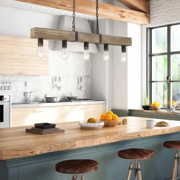 The Garrett 5-Light Island Light combines rustic charm with modern farmhouse style, featuring five lights mounted on a reclaimed-style natural wood beam with antique black iron accents. The heavily textured finish reveals warm gold undertones, creating an authentic handcrafted appearance perfect for kitchen islands and dining spaces. - alternate view
