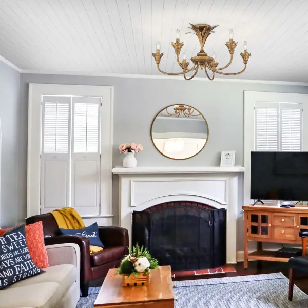The Lillianne semi-flush mount brings warmth and rustic charm with intricate floral and leaf motifs in an Heirloom Gold finish. Its multi-layered design creates visual interest while providing ample illumination for mid-height ceilings. - alternate view