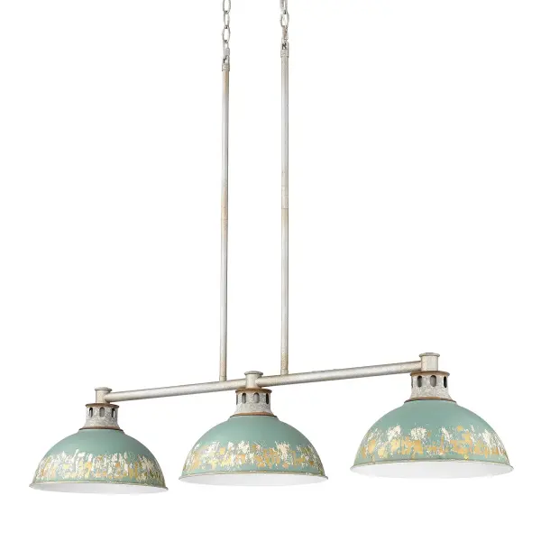 The Kinsley 3-Light Island Light combines farmhouse warmth with industrial edge through its distinctive distressed Antique Teal shades and Aged Galvanized Steel frame. The heavily textured finish reveals layers of gold leaf and off-white, creating visual depth that beautifully reflects light across kitchen islands and dining spaces.
